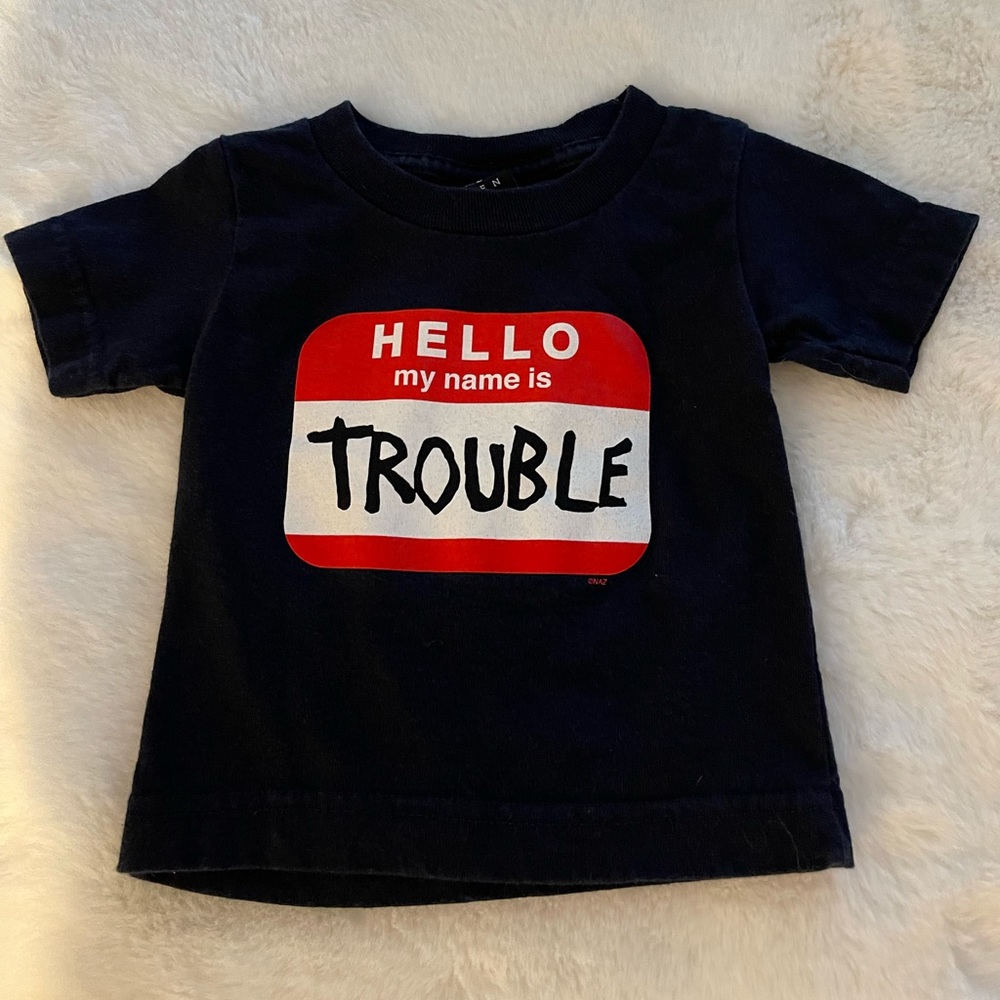 Now and Zen  Infant size 6months  Hello my name is trouble “sticker” (words)